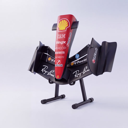 Matte black Ferrari-inspired front wing sculpture at an angle, raised on a black floor stand