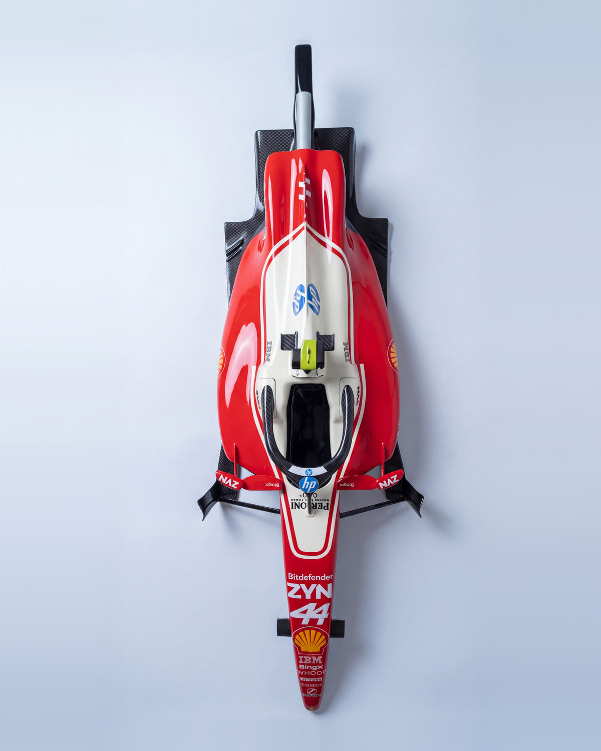 Formula 1-inspired cockpit wall sculpture in gloss red and white, top surface facing the viewer