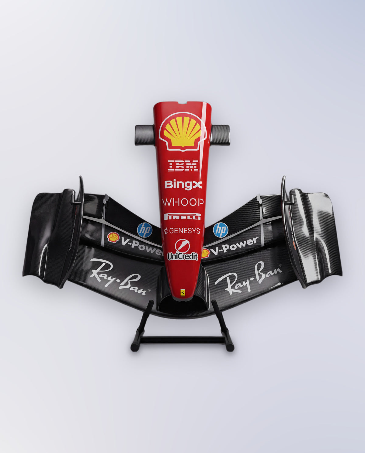 Head on view of the gloss carbon-effect Ferrari-inspired front wing sculpture and red nose