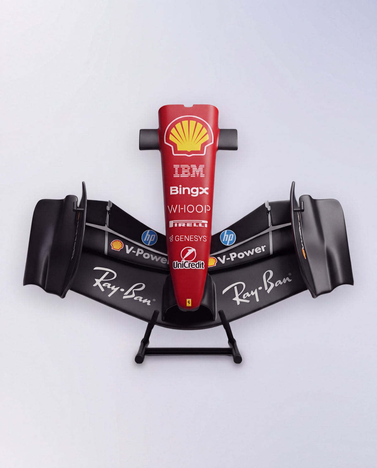 Ferrari-inspired front wing sculpture in matte black, viewed head on with red sponsor nose